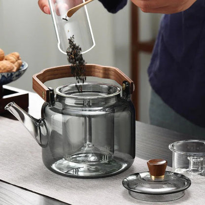 Dark glass teapot with removable infuser and wooden lid